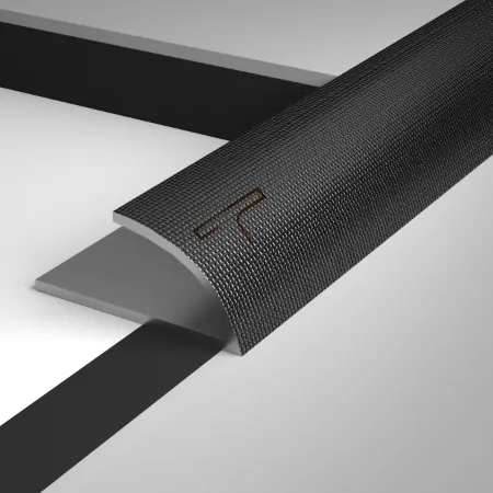 Flooring joint protected with metal tile trim